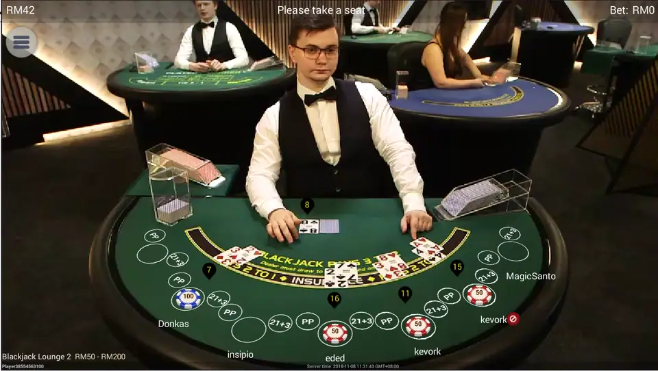 Blackjack Lounge 2 on NTC33 with a dealer in a waistcoat, a green felt and seven seats, limits RM50 to RM200